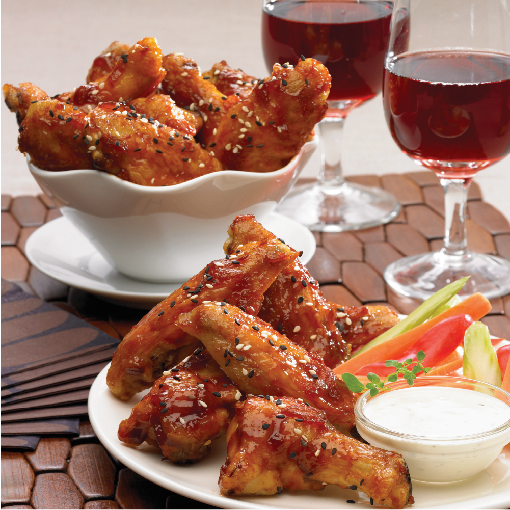 Buffalo & Sriracha Wings with wine in the background