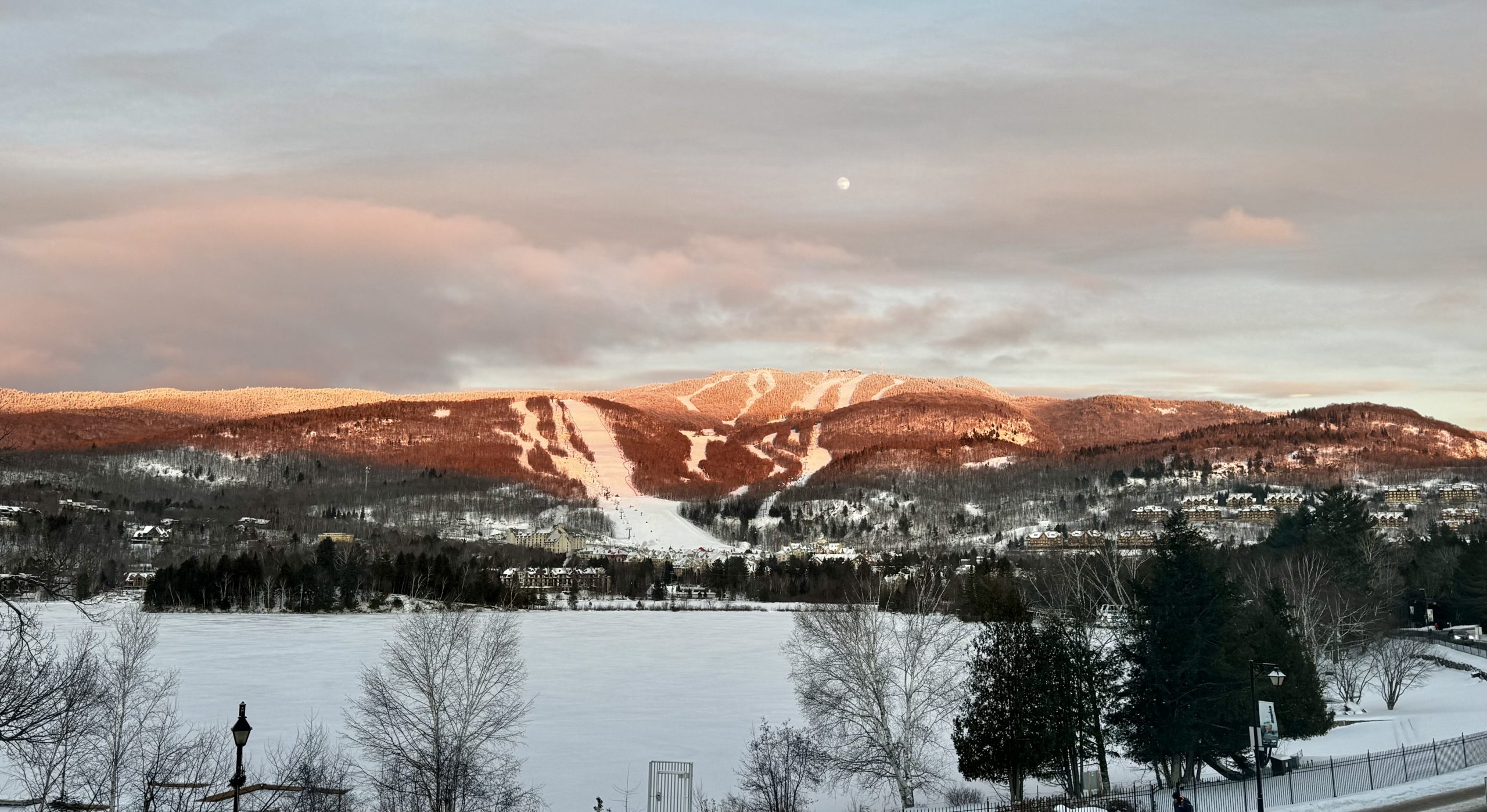 Mont-Tremblant from accross the lake with the sun hitting the top of the mountain